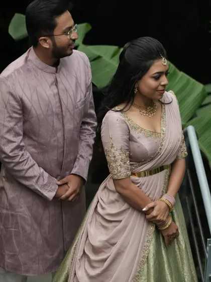 A candid moment with her partner, showing how the coordinated outfits create a beautiful picture.