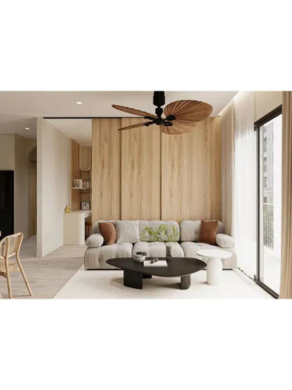 A living room featuring a unique leaf-shaped ceiling fan. This small detail adds a touch of tropical, biophilic design to the otherwise modern and minimalist space.