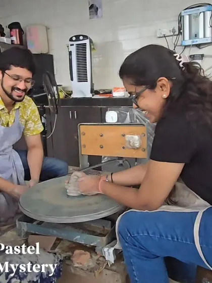 Laughter and learning go hand in hand at our studio. This couple shares a smile while getting the hang of the pottery wheel, a typical moment from our fun-filled workshops.
