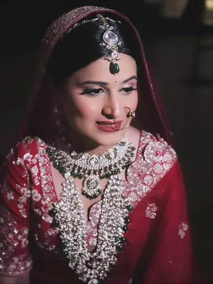 A classic bridal portrait. Her makeup is set for a long day, with a focus on a crease-proof base and eyes that stand out beautifully.