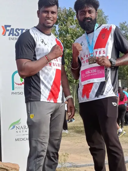 With a fellow athlete at the ultra marathon. The running community in namma Bengaluru is strong, and we support each other's goals.
