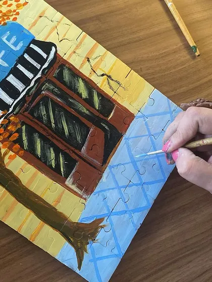 A close-up of a puzzle painting in progress. It's a fun challenge to paint a picture that will eventually be taken apart and put back together.