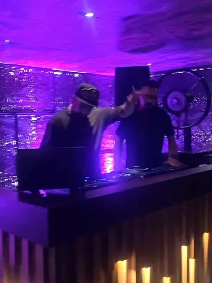 A view of the DJ booth at Kaze, with me and my partner getting the crowd hyped.
