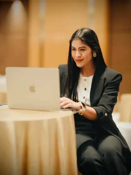 This photo captures me in a professional setting, preparing for a talk. It represents the focus and dedication I bring to every corporate engagement.