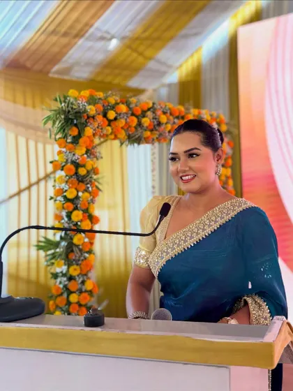 A happy, confident smile from the podium. My positive energy is contagious and helps create a celebratory mood.