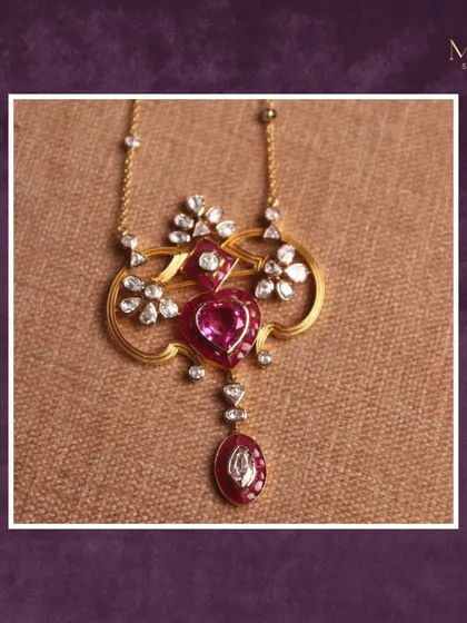This solitaire pendant is a beautiful blend of classic and modern. It features a heart-shaped pink gemstone with a floral diamond halo, creating a look that is both romantic and sophisticated.