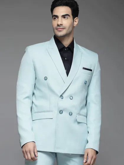 This sky blue double-breasted suit is a fresh take on formal wear. A pre-loved piece that adds a pop of color and modern flair to your collection.