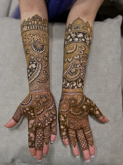 This design features architectural dome motifs on the top, flowing down into intricate paisley and floral patterns.