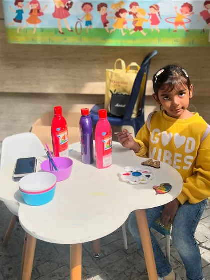 This little artist is bringing good vibes and bright colors to her project. Our stalls are designed to be a welcoming and fun space for all.