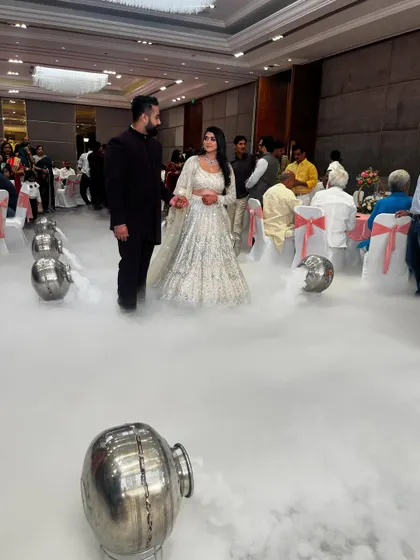 A dreamy couple's entry for their engagement. We filled the aisle with low-lying smoke, making it seem as if they are walking on clouds as they enter the hall.