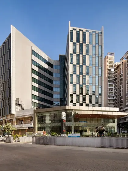 Sarvodaya Hospital in Greater Noida repurposes a former mixed-use commercial complex into a 300-bed super-speciality facility. The semi-unitized facade gives the hospital a distinct identity while remaining contextual to its dense residential surroundings.