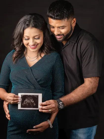 A first glimpse of your baby. This couple shares a loving look at their sonogram picture, a powerful reminder of the little person they are about to welcome.