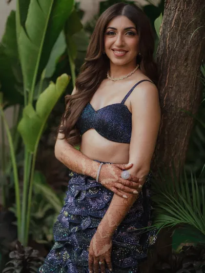 A happy, smiling portrait of Sheena. Her makeup enhances her features and gives her a radiant glow that looks beautiful in photos.