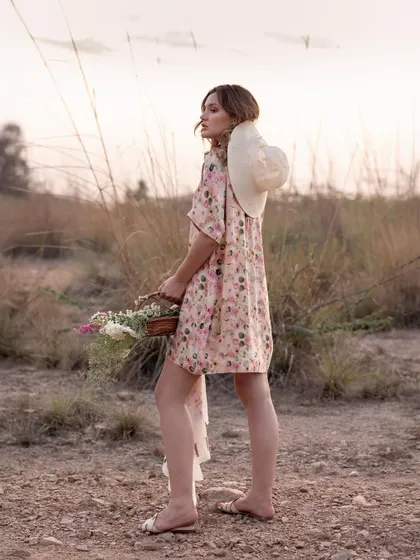 A shot from behind shows the dress in motion as the model walks. This perspective is great for highlighting the fit and flow of a garment from all angles.