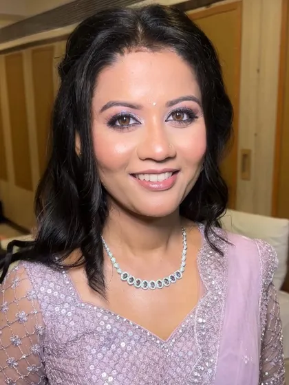 A close-up of my sister's reception makeup. The soft lilac eyeshadow and glowing skin created a look that was both elegant and personal to her style.