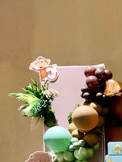 A detail shot of the balloon garland and monkey cutout from the jungle party.