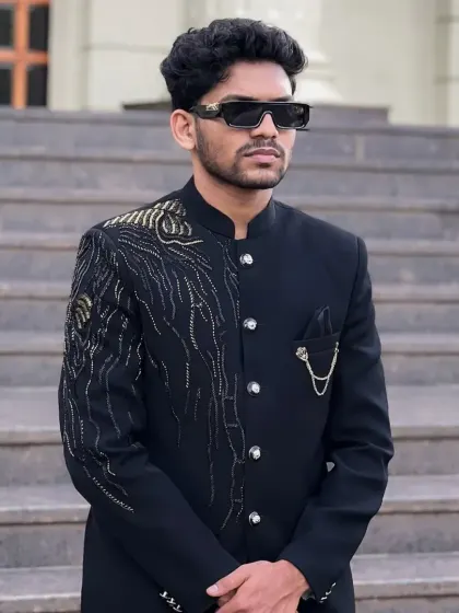 A closer view of the peacock feather embroidery on the black Jodhpuri suit.