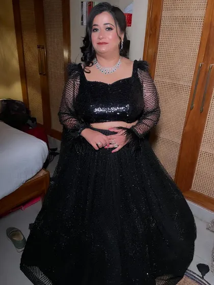 Another full-length shot showing her stunning cocktail outfit. The soft curls and glowing makeup complete the look perfectly.