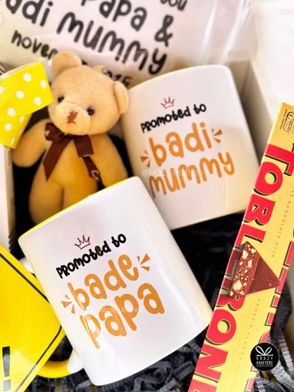 A sweet surprise for the 'Bade Papa' and 'Badi Mummy' to be. This hamper features custom mugs and a tiny teddy bear, all packed with love.