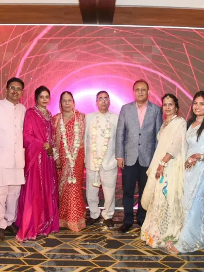 A formal group portrait of the couple with their close family.