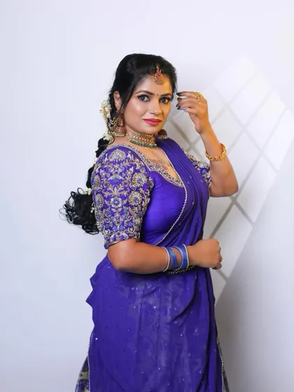 A royal blue blouse with heavy zardozi and thread work on the sleeves. This kind of statement piece can elevate even a simple saree.