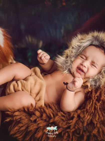 Hear me roar. This little lion cub is one of our favorite themes for baby boys, complete with a fuzzy lion bonnet and a cozy, wild setting.
