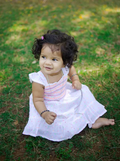 A simple, beautiful portrait in the grass. Sometimes the most precious photos are the ones with the least props, where the baby's natural charm shines through.