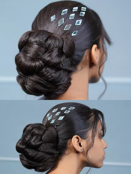 A finished pulling bun, decorated with modern mirror accessories. This shows how to combine classic techniques with contemporary trends.