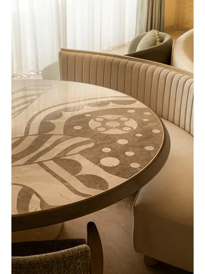 The intricate marble inlay on the dining table at Soft Serve is a testament to our love for detailed craftsmanship. It transforms a simple surface into a piece of functional art.