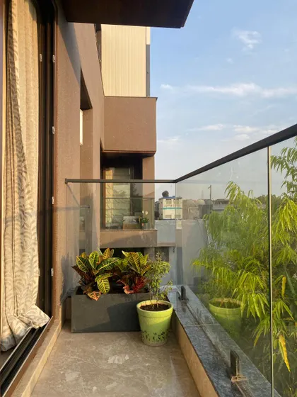 A view of a recent balcony project where I used a mix of planters to add life to the space. The combination of colorful Crotons and other foliage plants creates a vibrant and welcoming atmosphere.
