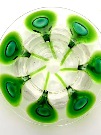 A duplicate top-down view of the Loetz-style bowl, again highlighting the beautiful symmetry of the peacock feather design.