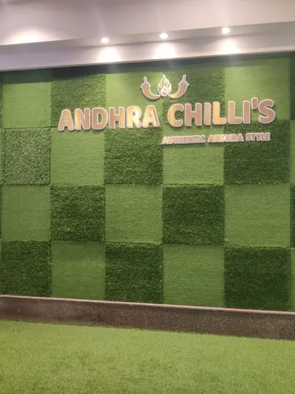 An artificial grass wall designed for the Andhra Chilli's restaurant. The checkerboard pattern using two different turf textures adds a unique, branded touch to their interior.