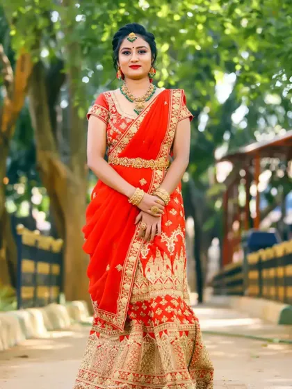 This is a perfect example of a complete reception look. The makeup is flawless, the hair is elegantly styled, and the dupatta is draped and pinned perfectly to stay in place.