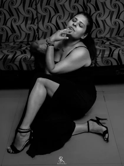 A moody, artistic shot from my 'Black Magic' series, featuring the black bodycon gown. Style is as much about attitude as it is about the clothes.