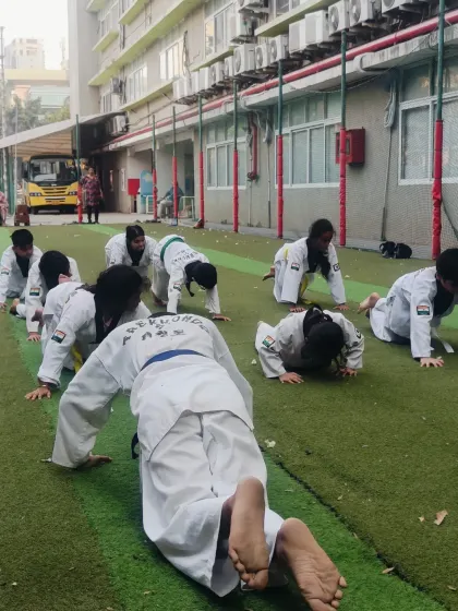 The entire class doing push-ups together. This builds a sense of unity and pushes everyone to keep going.