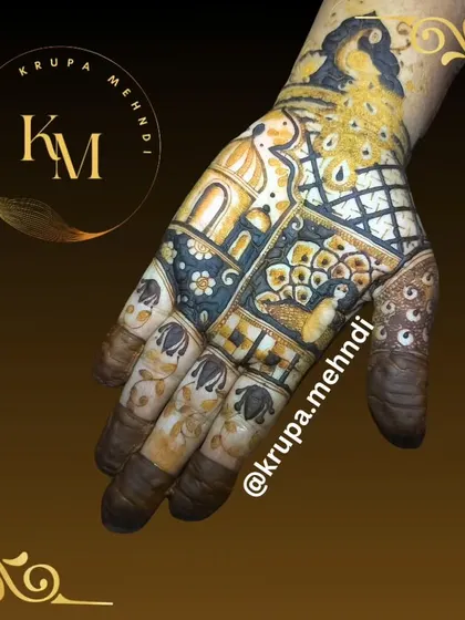 A beautiful patchwork-style design featuring a peacock, a palace window, and various traditional fillers. Which type of mehndi is your favorite?
