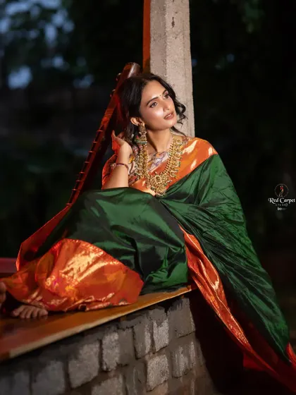 A beautiful nighttime shot of Kaavya Shastry. The rich silk and antique gold jewelry create a look of timeless elegance.