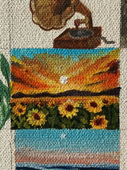 A mini-painting of a sunflower field at sunset.