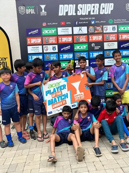 Our U11 team celebrates with Nishal after he was named Player of the Match. Team support is a huge part of individual success.