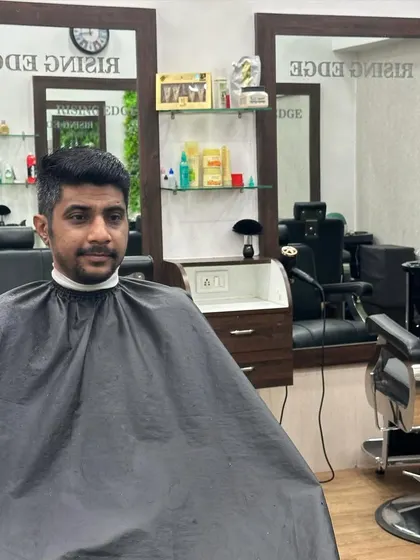 The final look after a detailed haircut. A simple, clean style that enhances the client's features.