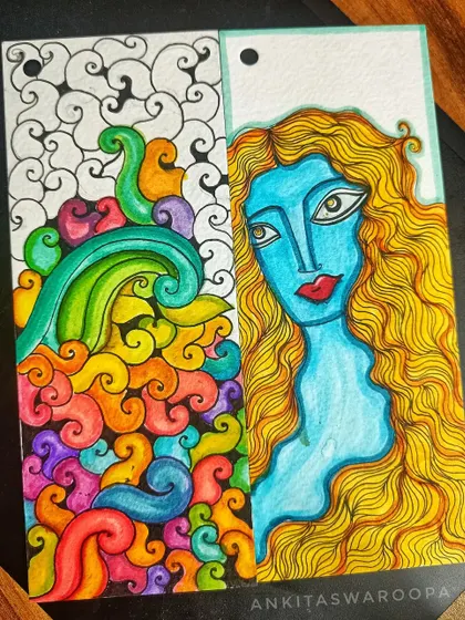 I'm not working on anything big right now, just creating these happy, bright bookmarks. One side features a colorful abstract doodle, while the other has a portrait of a woman, a small piece of my imagination.