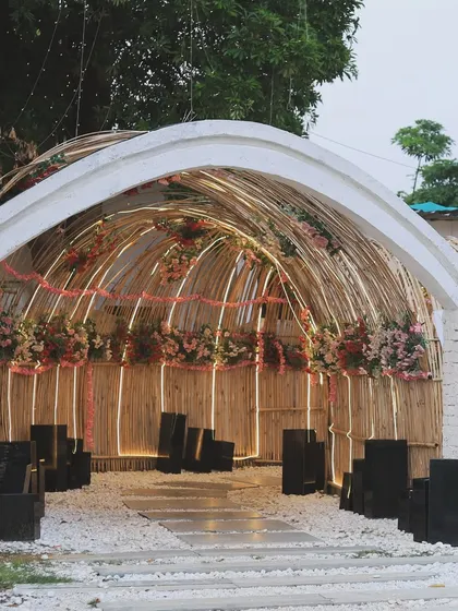 The lit-up bamboo tunnel at our entrance, decorated with flowers for a special event.