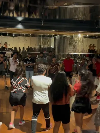 The entire room is dancing! A shot from the back of a packed dance fitness event.