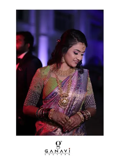 Our charming bride Varsha in an unconventional yet stunning ensemble. Her blouse features a fine mix of colors and details, intricately put together to create a unique look for her special day.