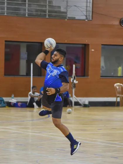 Capturing the peak moment of athletic power. This handball player is frozen mid-air, muscles tensed, right before releasing a powerful shot during a training session for the National Games. This is the kind of explosive action photography I love to shoot.
