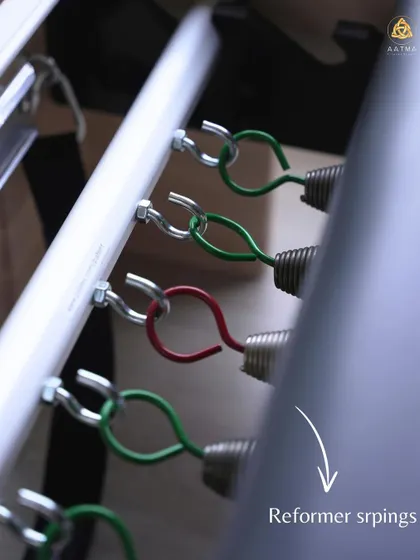 The reformer springs are the heart of the machine. Their different tensions allow me to customize the resistance for each client and every exercise, ensuring a perfectly tailored workout.