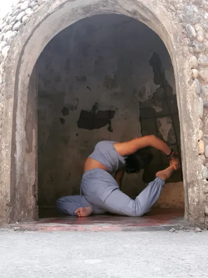Exploring a deep backbend, Rajakapotasana, within a quiet, cave-like space. For me, yoga is not just a physical pose but a deep connection with myself and the universe around me.