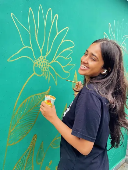 Painting walls and loving life. A happy moment captured while working on a metallic gold floral mural.