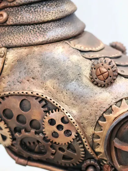 A close-up of the intricate gear work on my gold-medal-winning Steampunk horse cake. I teach how to use fondant and molds to create detailed mechanical elements like these.