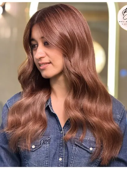 A beautiful smile to go with her new deep, dimensional brown hair. The color perfectly complements her skin tone and adds a touch of glamour.